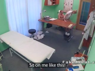 Medico eats and fucks nurse on a desk